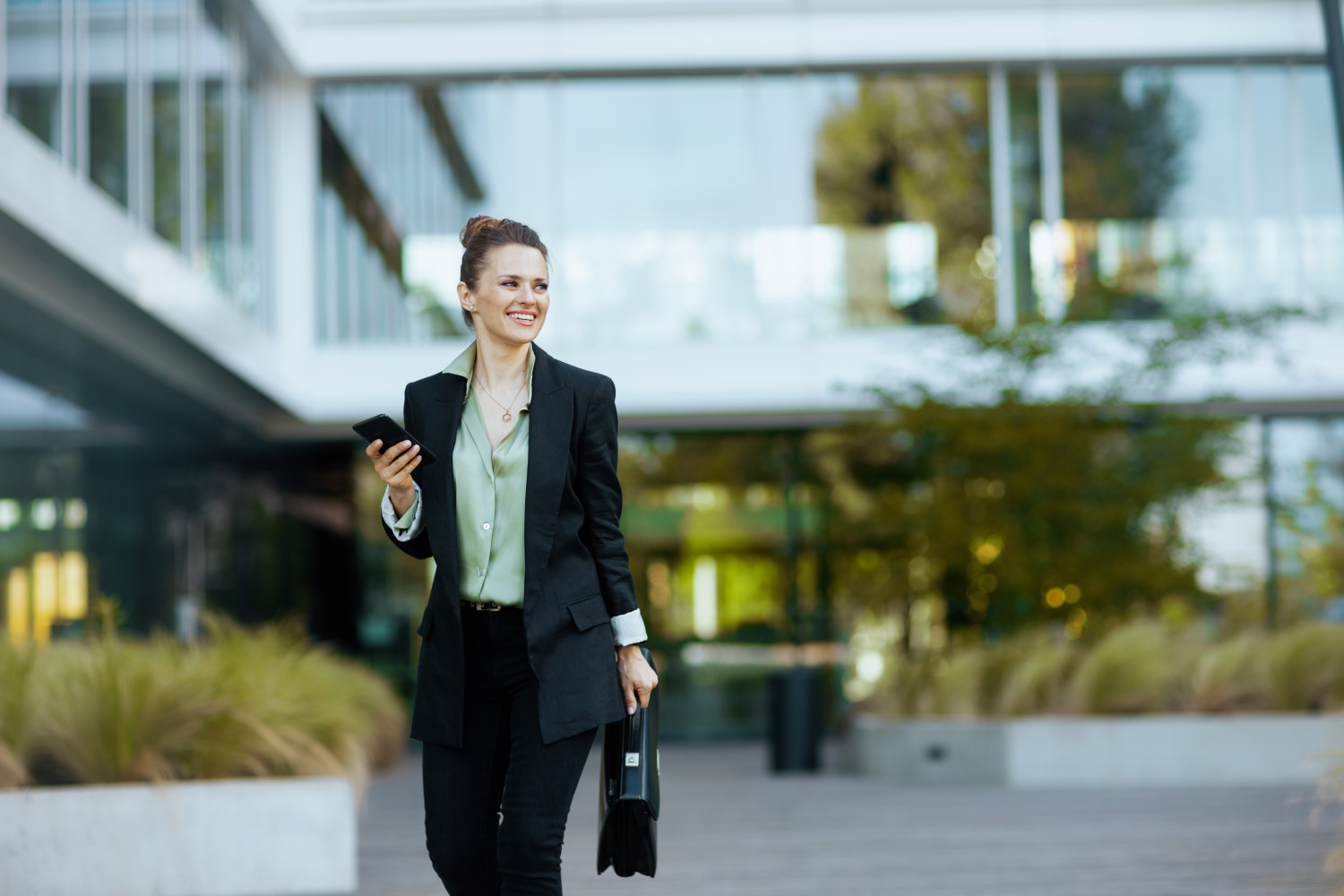 happy woman worker near business center
